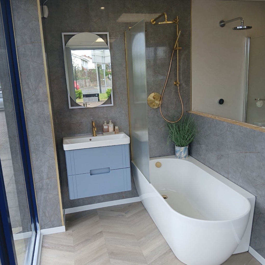 Bathroom with bath, glass screen and wall-hung vanity
